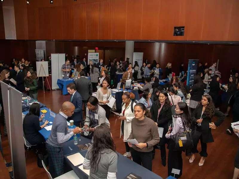 Job fair with lots of women students checking out potential employers